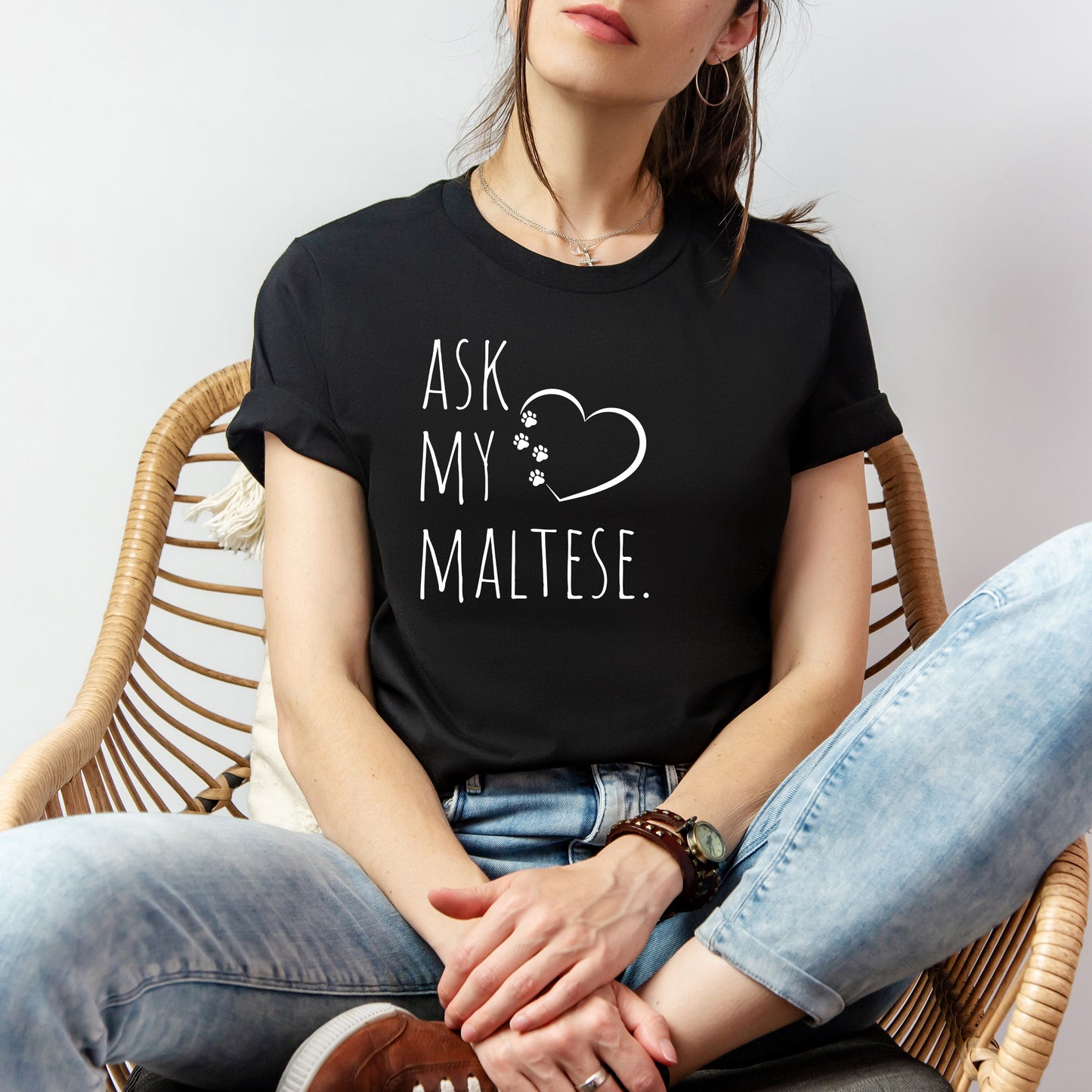 "Ask My Maltese" T-Shirt featuring a heart with two paw prints, perfect for dog lovers and Maltese owners. Unisex design for men and women. Available in multiple colors and sizes. Bella+Canvas 3001 t-shirt in black. ReadyShirtAim.com