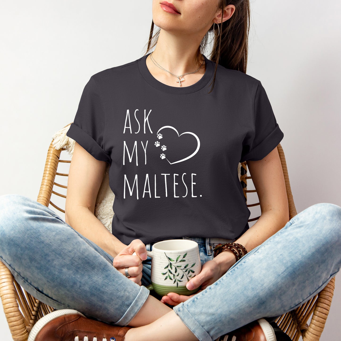 "Ask My Maltese" T-Shirt featuring a heart with two paw prints, perfect for dog lovers and Maltese owners. Unisex design for men and women. Available in multiple colors and sizes. Bella+Canvas 3001 t-shirt in dark grey. ReadyShirtAim.com