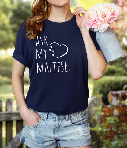 "Ask My Maltese" T-Shirt featuring a heart with two paw prints, perfect for dog lovers and Maltese owners. Unisex design for men and women. Available in multiple colors and sizes. Bella+Canvas 3001 t-shirt in navy. ReadyShirtAim.com