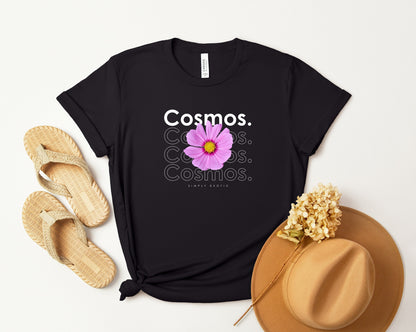 A photo-realistic mauve on fuchsia and yellow cosmos t-shirt with a bold contemporary floral design and the caption "Simply Exotic." Perfect for cosmos lovers, botanical enthusiasts, and nature lovers. Bella+Canvas 3001 t-shirt in black. ReadyShirtAim.com