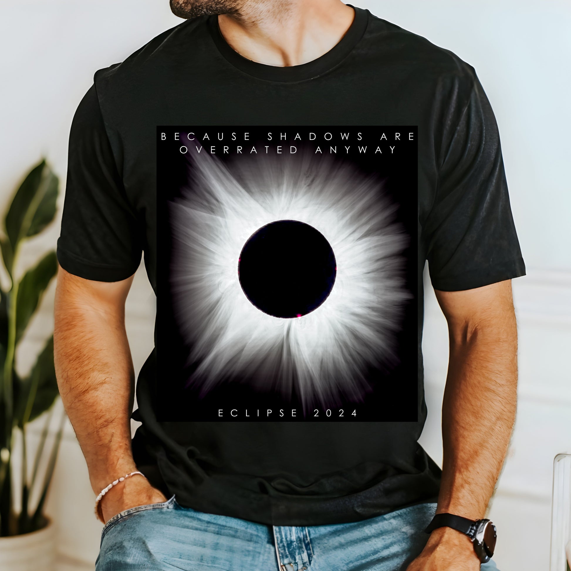 A unique t-shirt featuring an authentic solar event photograph for Eclipse 2024 with the witty caption "Because Shadows Are Overrated Anyway." Perfect for astronomy enthusiasts, star gazers, and science lovers. Bella+Canvas 3001 t-shirt in black. ReadyShirtAim.com