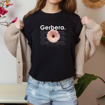 A photo-realistic pale peach gerbera t-shirt with a bold contemporary floral design and the caption "Refined Beauty." Perfect for gerbera lovers, botanical enthusiasts, and nature lovers. Bella+Canvas 3001 t-shirt in black. ReadyShirtAim.com