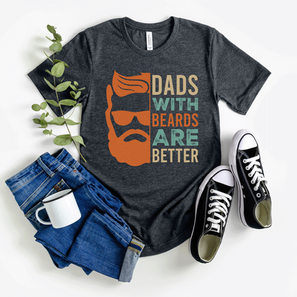 A funny t-shirt with the slogan "Dads With Beards Are Better" in bold letters, perfect for Father's Day or any dad with a beard who loves a good laugh. Available in multiple colors and sizes. Bella+Canvas 3001 t-shirt. ReadyShirtAim.com