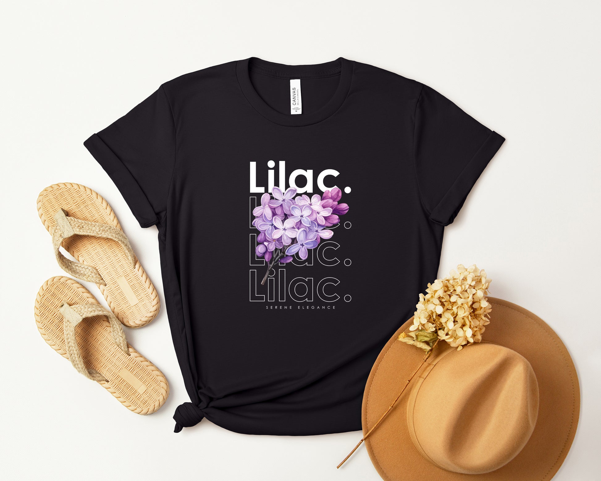 A watercolor lilac t-shirt with a bold contemporary floral design and the caption "Serene Elegance." Perfect for lilac lovers, botanical enthusiasts, and nature lovers. Bella+Canvas 3001 t-shirt in black. ReadyShirtAim.com