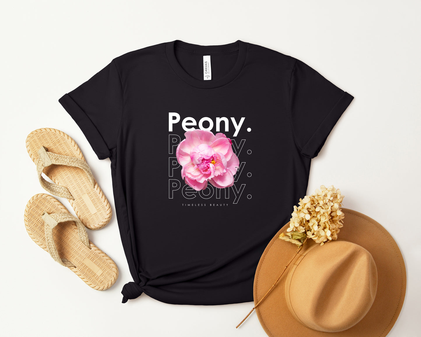 A photo-realistic pale pink and white peony t-shirt with a bold contemporary floral design and the caption "Timeless Beauty." Perfect for peony lovers, botanical enthusiasts, and nature lovers. Bella+Canvas 3001 t-shirt in black. ReadyShirtAim.com