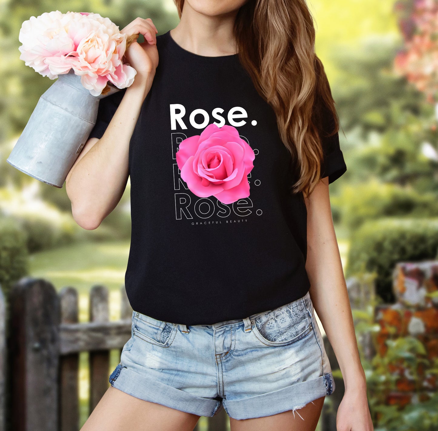 A t-shirt featuring a beautiful pink photo-realistic rose with the theme 'Graceful Beauty.' Perfect for those who adore floral art and nature. Comfortable and stylish for casual outings or celebrations. Bella+Canvas 3001 t-shirt in black. ReadyShirtAim.com