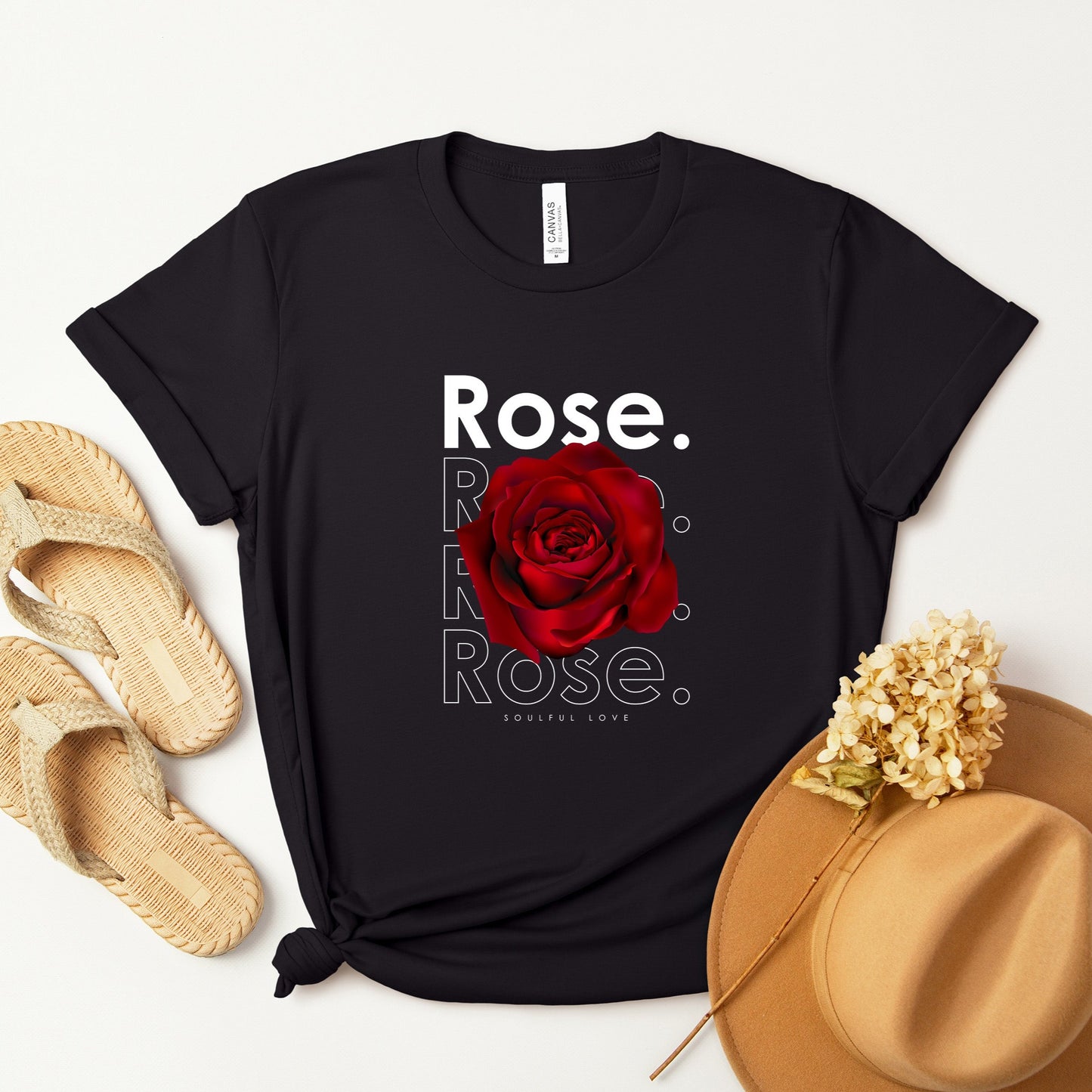 A t-shirt featuring a stunning deep red rose with the theme 'Soulful Love.' Perfect for those who adore bold floral art and nature. Comfortable and stylish for casual outings or celebrations. Bella+Canvas 3001 t-shirt in black. ReadyShirtAim.com