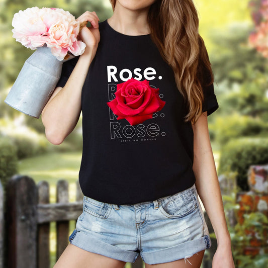 A t-shirt featuring a stunning deep red photo-realistic rose with the theme 'Striking Wonder.' Perfect for those who adore bold floral art and nature. Comfortable and stylish for casual outings or celebrations. Bella+Canvas 3001 t-shirt in black. ReadyShirtAim.com