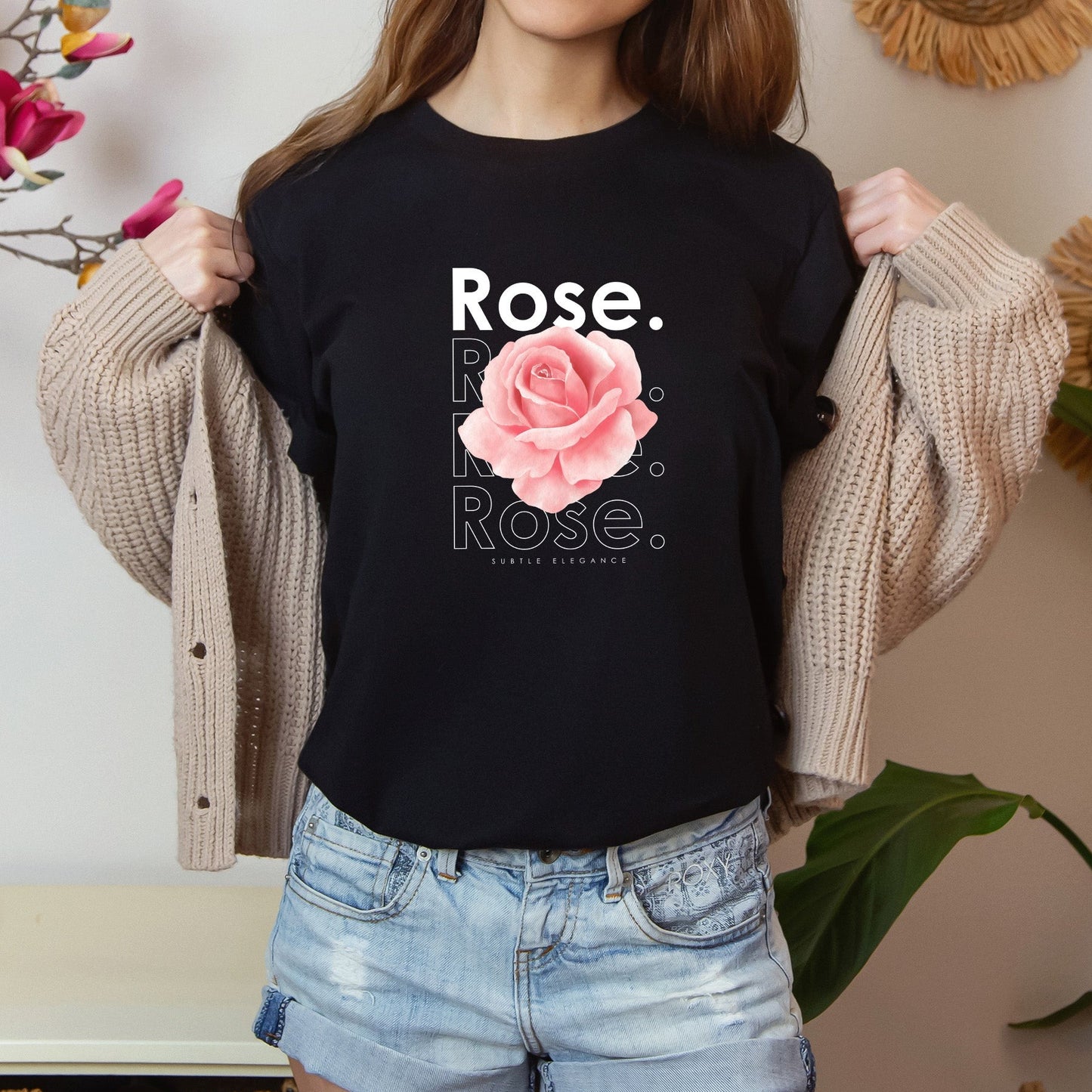 A t-shirt featuring a beautiful pale pink watercolor rose with the theme 'Subtle Elegance.' Perfect for those who adore floral art and nature. Comfortable and stylish for casual outings or celebrations. Bella+Canvas 3001 t-shirt in black. ReadyShirtAim.com