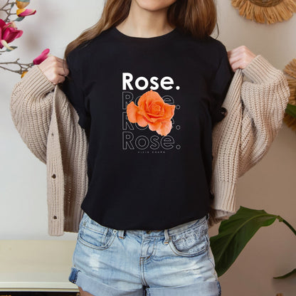 A t-shirt featuring a beautiful apricot watercolor rose with the theme 'Vivid Charm.' Perfect for those who adore floral art and nature. Comfortable and stylish for casual outings or celebrations. Bella+Canvas 3001 t-shirt in black. ReadyShirtAim.com