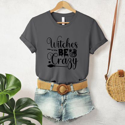 "Witches Be Crazy" Funny and Sarcastic Halloween Unisex T-Shirt featuring bold black text, perfect for adding a humorous and witty touch to your Halloween festivities.