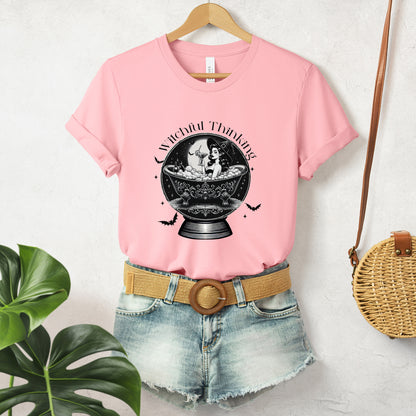 "Witchful Thinking" Vintage 1950's Witch Halloween Women's T-Shirt featuring black text and classic black-and-white pin-up girl images, perfect for adding a retro touch to your Halloween festivities. Available in multiple colors and sizes.  Bella+Canvas 3001 t-shirt in pink. ReadyShirtAim.com